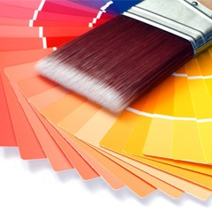 Close-up of paint brush and paint swatches