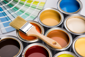 an assortment of paint cans